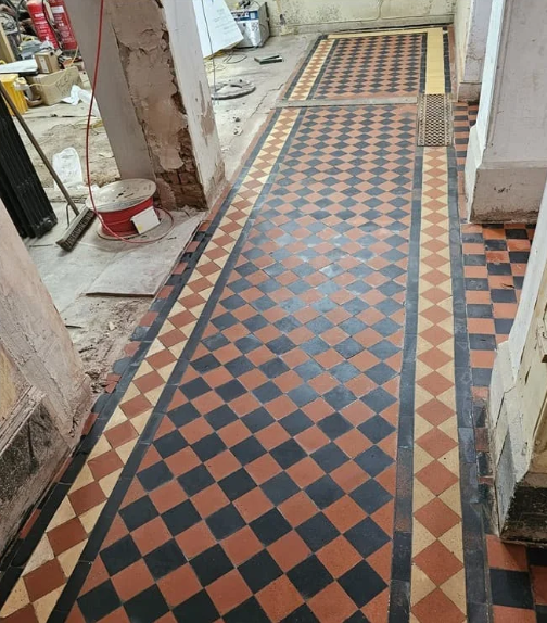 Historic quarry tile floor after controlled grinding and restoration at Ipswich Museum