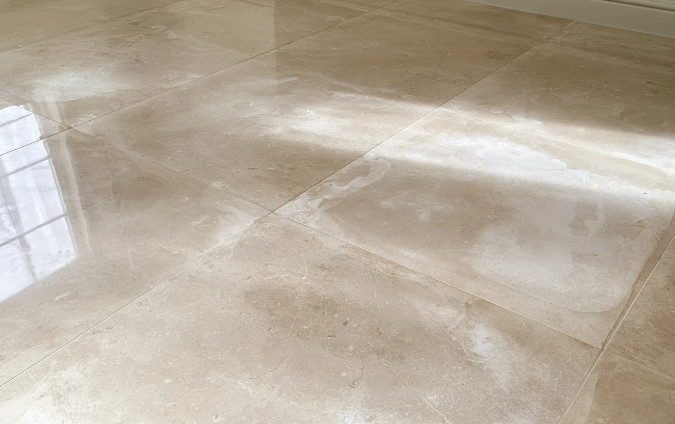 Patchy previous treatment on a matte tile surface