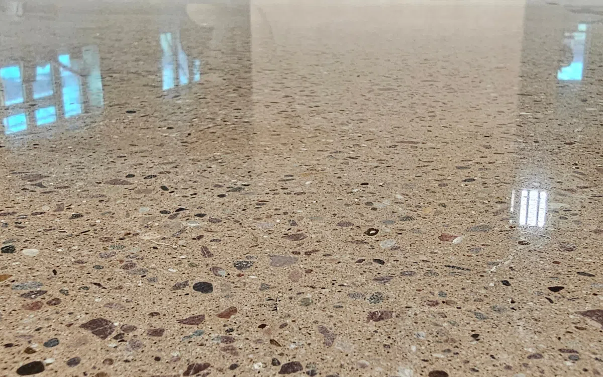 Polished concrete with minimal aggregate exposure