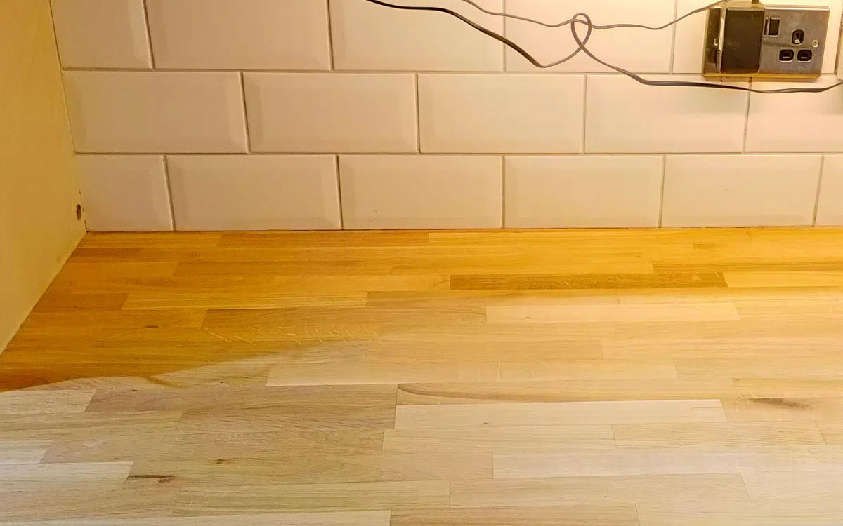 Professional restoration of a worn solid wood worktop